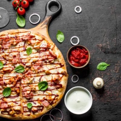 Crispy bacon bliss pizza with melted cheese from Boston Wings & Pizza in Allston MA