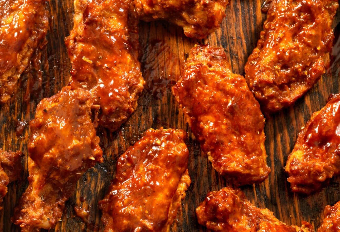 Bone-in wings and boneless wings side by side at Boston Pizza & Wings for comparison